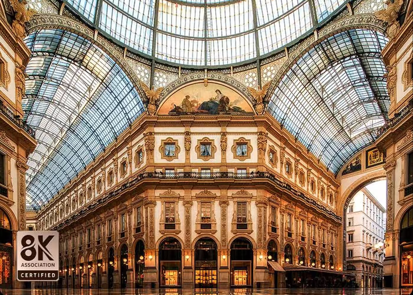 Grand architectural interior with a large glass dome in an urban setting