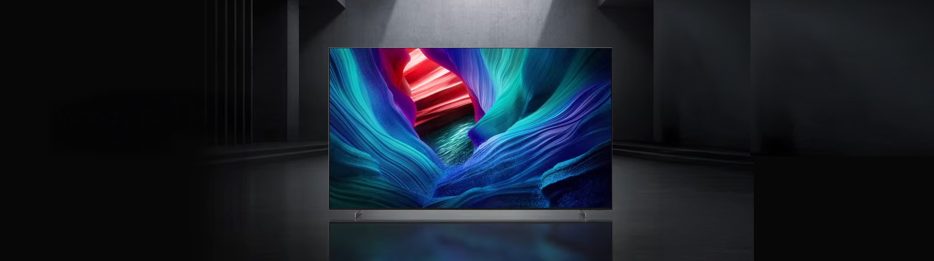 Modern TV displaying vibrant abstract colors in a dark room