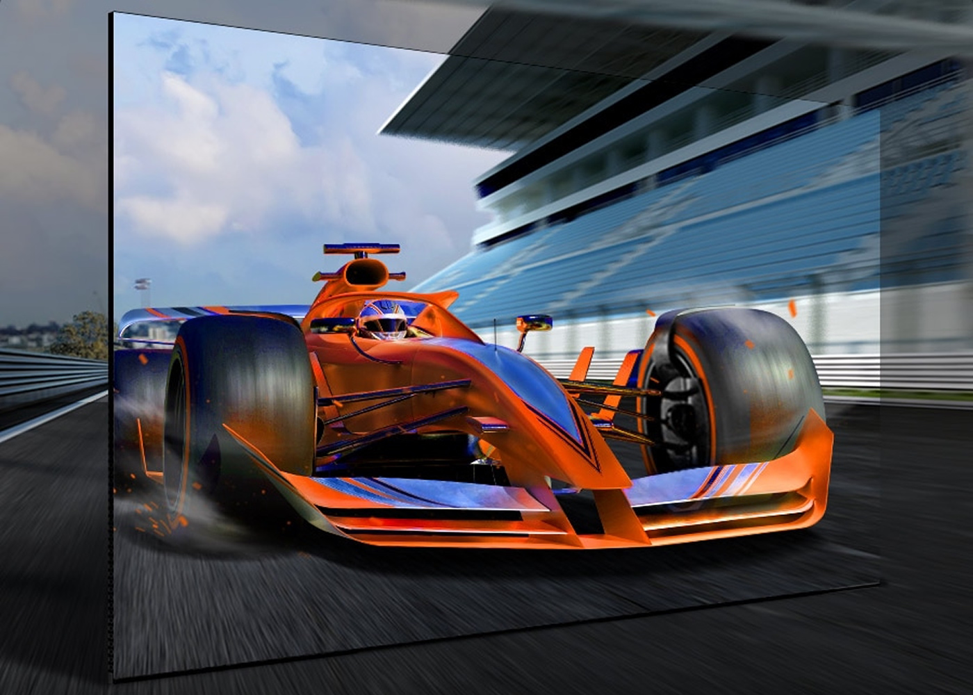 Orange and blue Formula 1 car on a race track with a large screen displaying the scene.