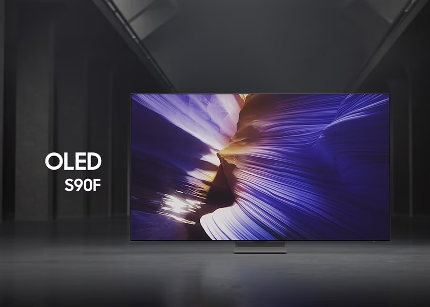 Sony OLED TV model S90F displaying vibrant colors in a dark room