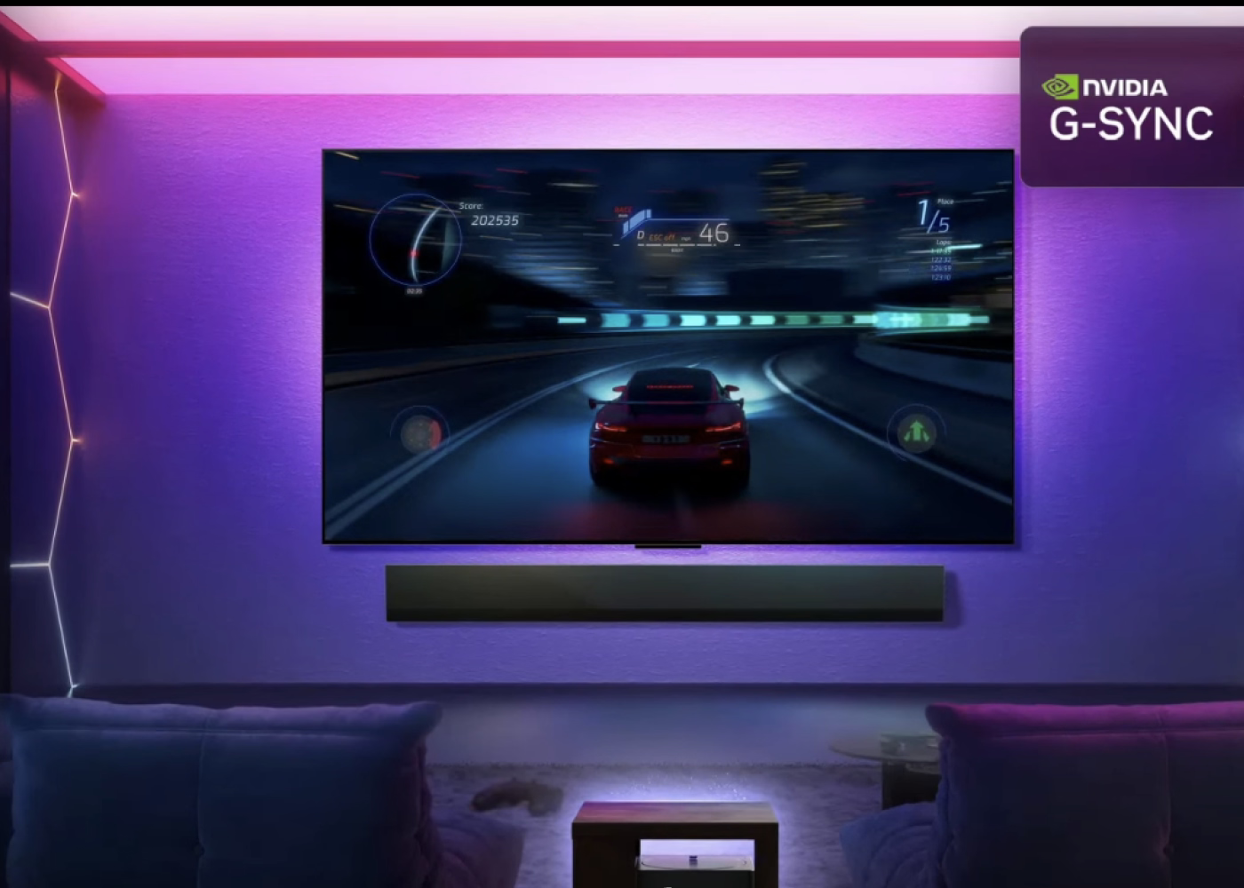TV screen displaying a racing game with NVIDIA G-SYNC logo in a dimly lit room.