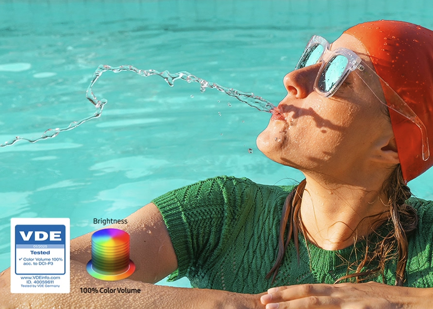Person in a pool with sunglasses and a green shirt, VDE logo visible