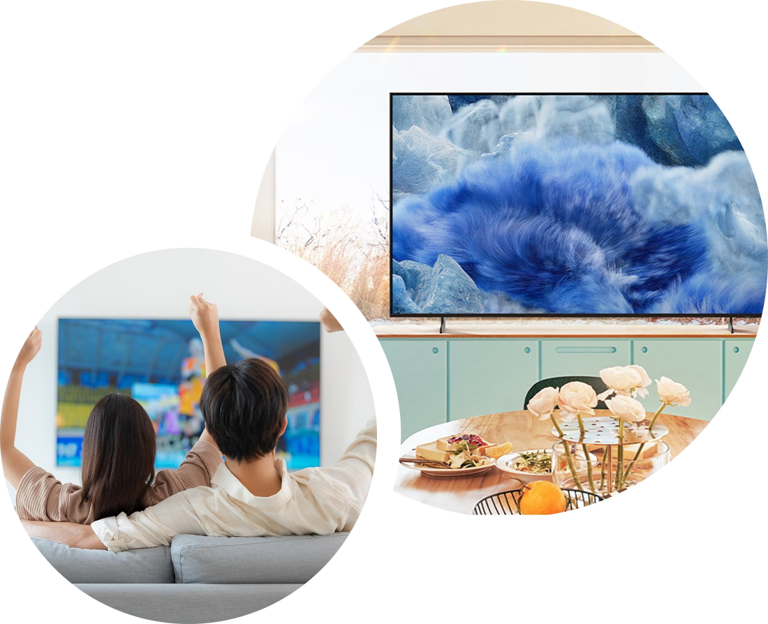 Two people watching TV in a living room with a large screen displaying a blue abstract design.