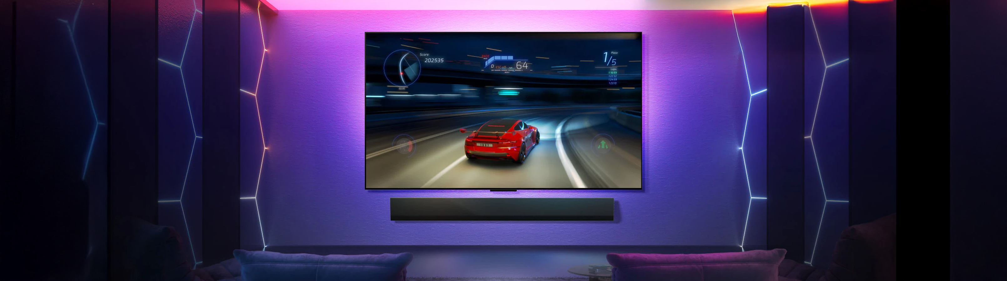 Modern living room with a large TV displaying a racing game, surrounded by decorative lighting.