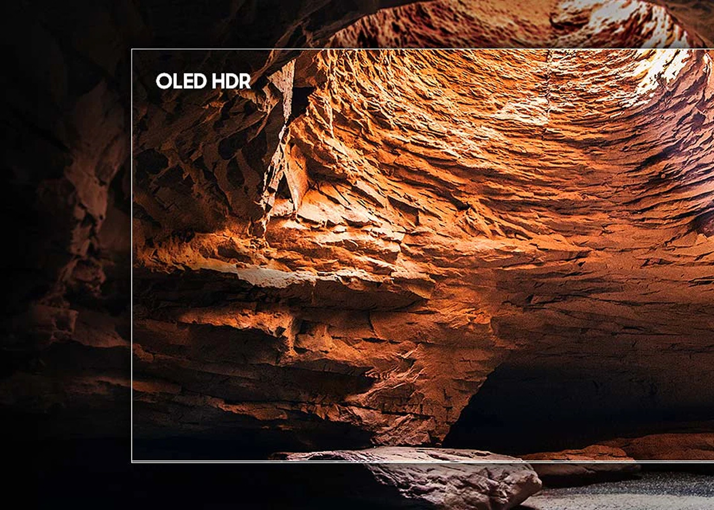 TV screen displaying an image of a rocky canyon with 'OLED HDR' text.