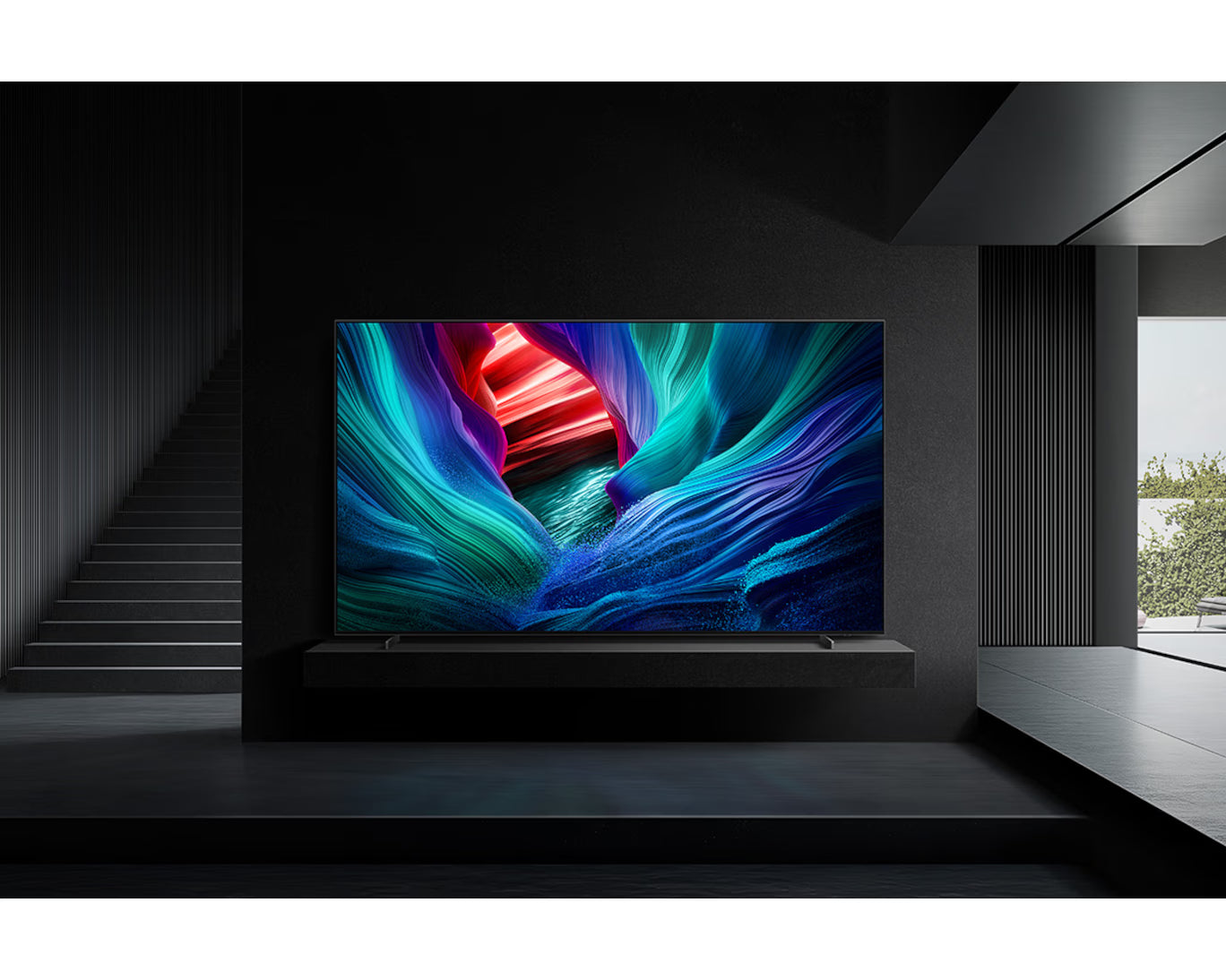 Large flat-screen TV displaying vibrant colors in a modern room.