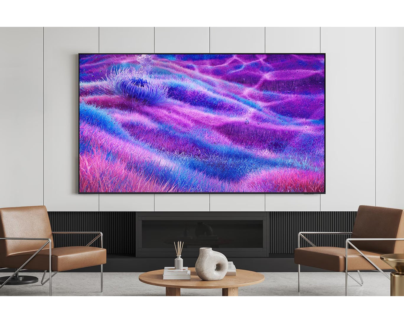 Modern living room with a large flat-screen TV displaying a colorful abstract design.