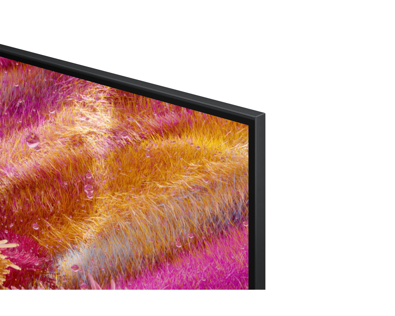 Close-up of a television screen displaying colorful abstract patterns on a white background