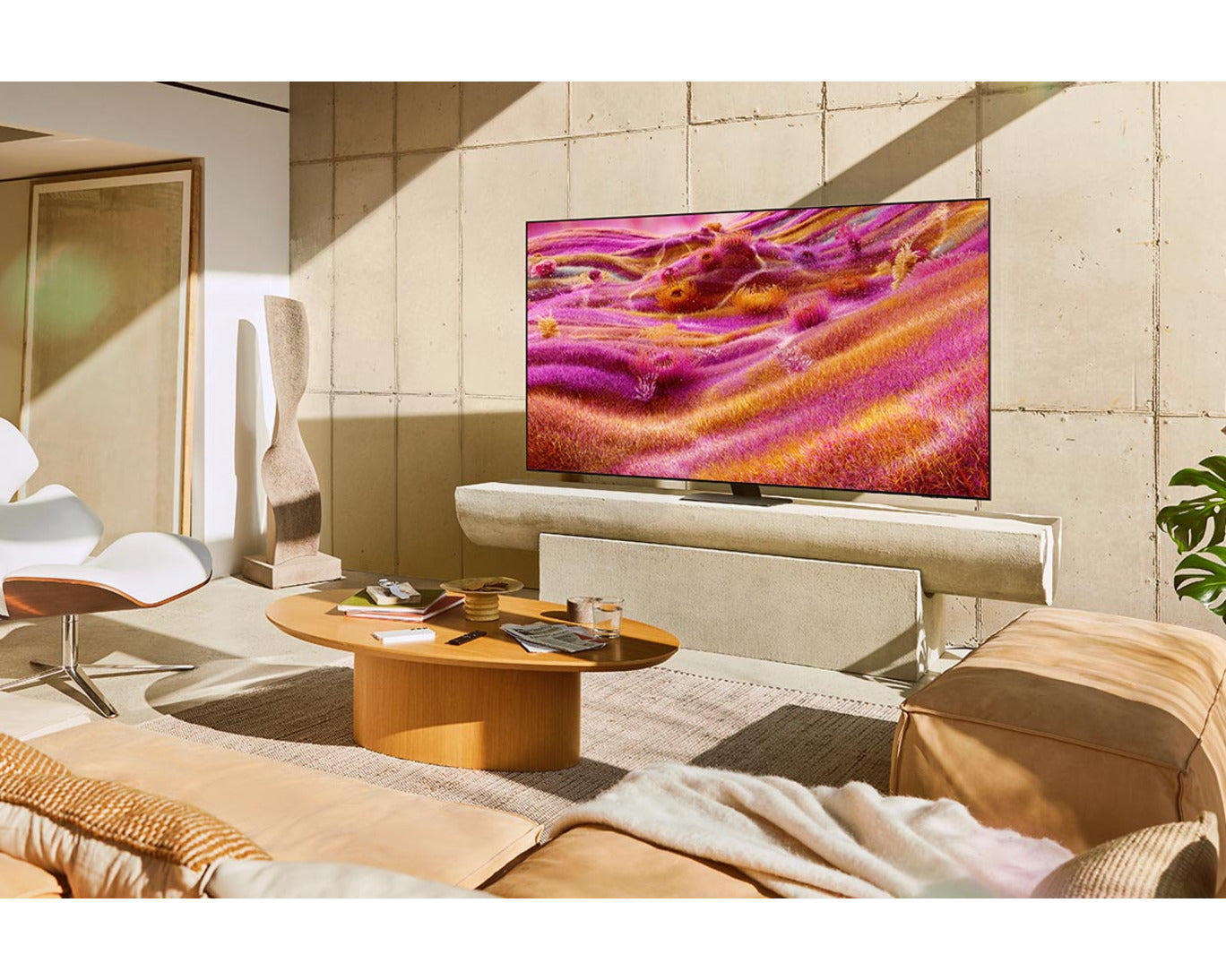 Modern living room with a large flat-screen TV displaying a colorful abstract design.