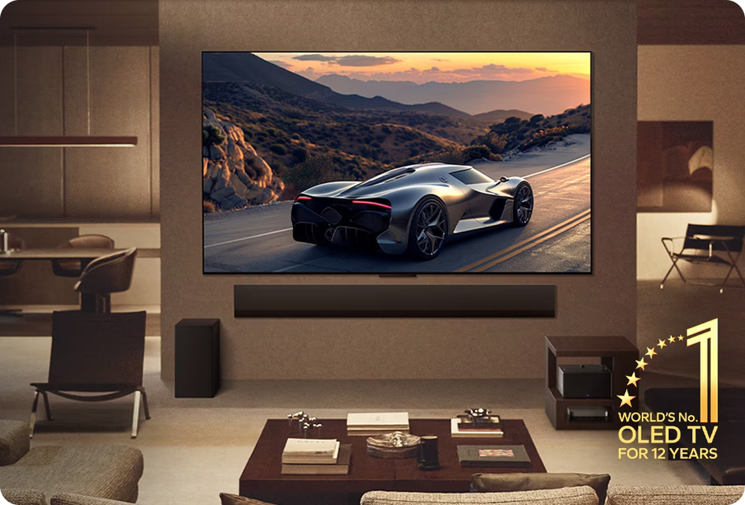 Modern living room with a large TV displaying a car on a scenic road, featuring a brand logo for a world-renowned OLED TV brand.