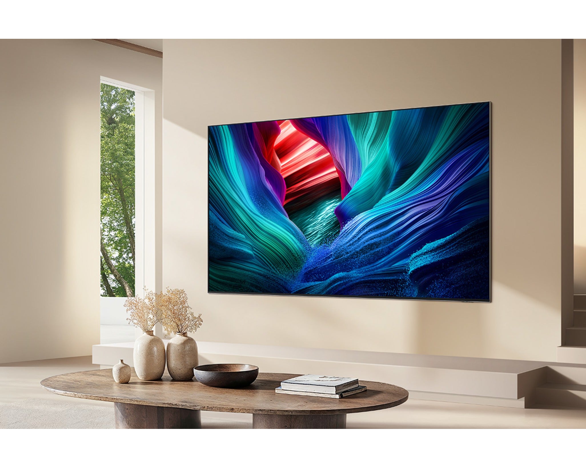 Modern living room with a large flat-screen TV displaying colorful abstract art.