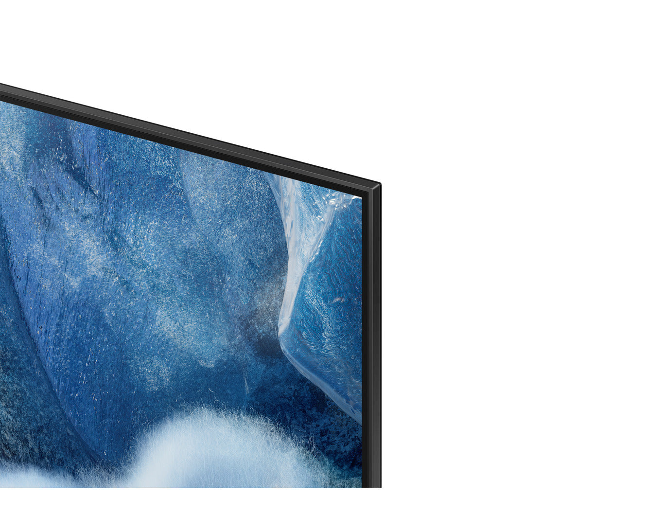 Close-up of a television screen displaying a blue abstract design.