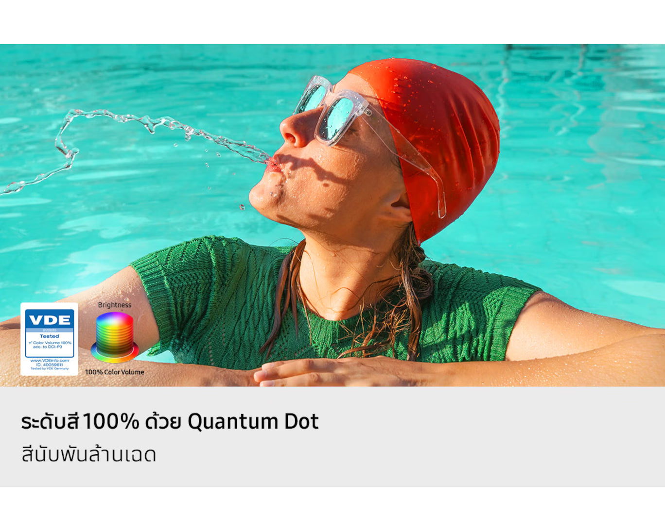 Person wearing a red swim cap and goggles, drinking water from a pool, with VDE logo and text about Quantum Dot technology.