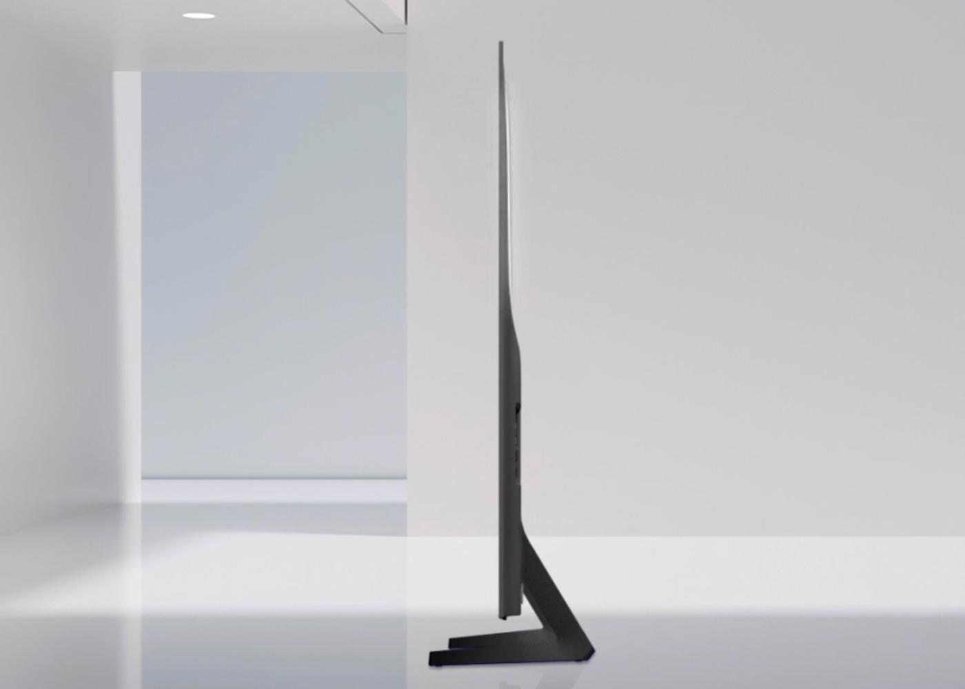 Modern black floor lamp against a white wall