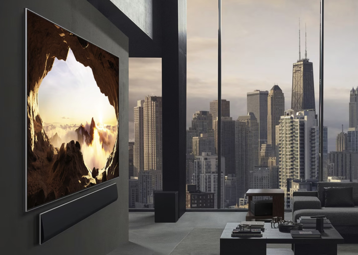Modern living room with a large TV displaying a nature scene, overlooking a city skyline.